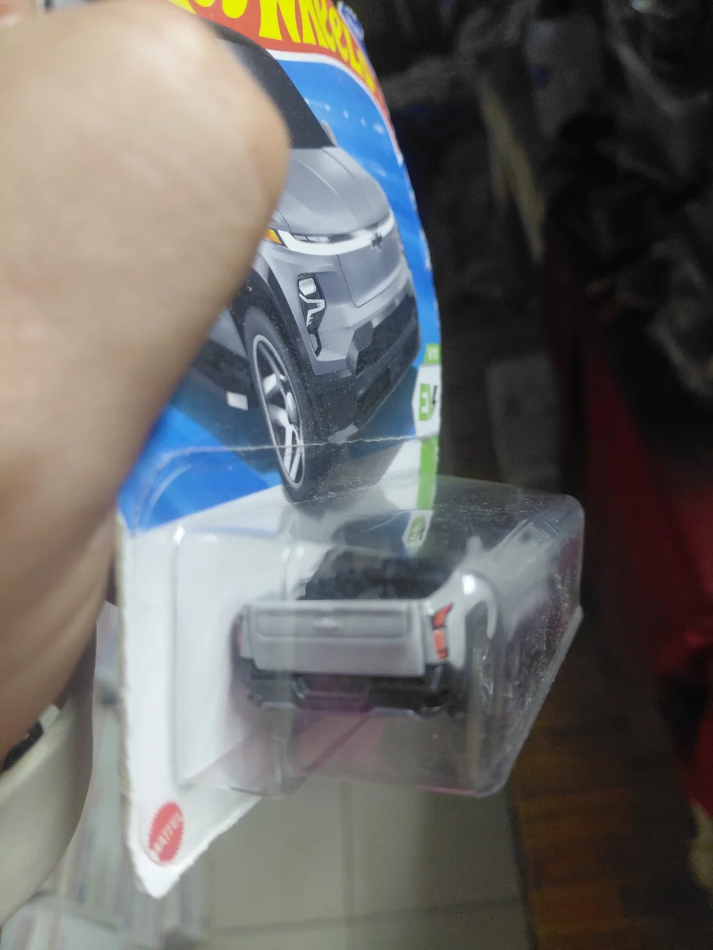 2025 Hot Wheels 1:64 scale diecast Chevrolet Silverado EV RST in matte grey.